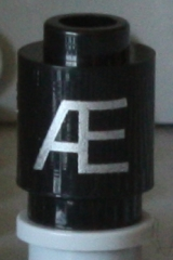 Brick, Round 1 x 1 with Silver Capital Letter Æ Pattern