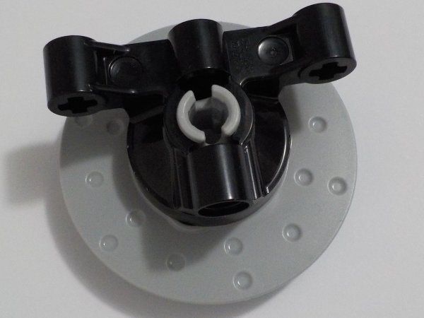 Technic, Steering Axle with 2 Pin Holes and 2 Arms with Axle Holes without Slots (Reinforced) with Light Bluish Gray Wheel Hub 3 Pin Holes Round (65766 / 35189)