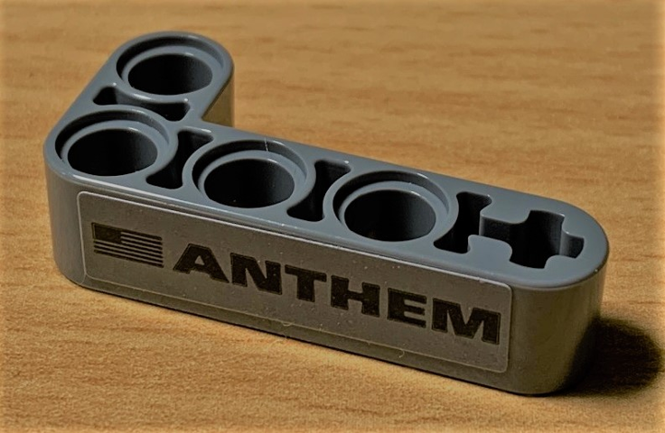 Technic, Liftarm, Modified Bent Thick L-Shape 2 x 4 with 'ANTHEM' and Black USA Flag Pattern (Sticker) - Set 42078