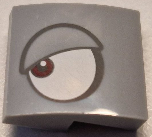 Slope, Curved 2 x 2 x 2/3 with White Eye, Dark Red Pupil and Dark Bluish Gray Outlined Eyelid Pattern Model Left Side (Super Mario Rambi)