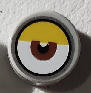 Tile, Round 1 x 1 with White Eye with Centered Reddish Brown Iris and Partially Closed Yellow Eyelid Pattern