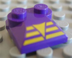 Slope, Curved 2 x 2 x 2/3 with 2 Studs and Curved Sides with Yellow Triangle on 3 Bars Pattern
